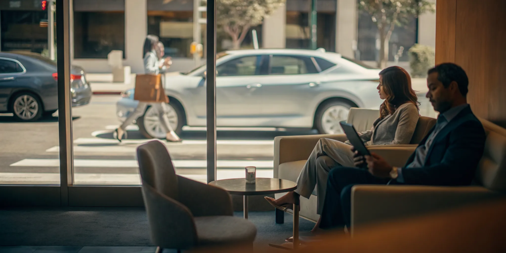 A lawyer for a pedestrian hit by a car discusses the case with a client in an office.