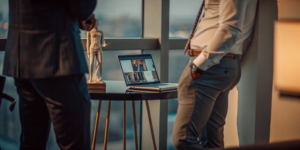 A top-rated personal injury lawyer reviews a case with a colleague in a law office.