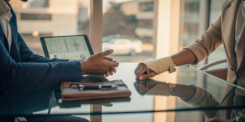 An injured person who needs an accident lawyer discusses their case during a consultation.