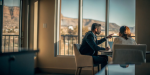 Personal injury attorney meeting with a client in an Albuquerque law office after a car accident