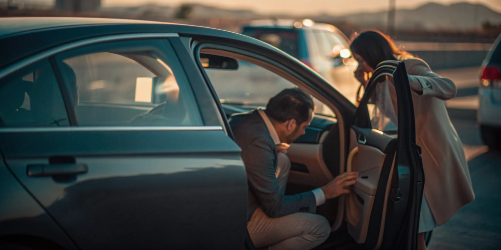 Rideshare car involved in a collision in New Mexico as an attorney speaks with an injured passenger